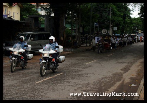 Cambodian Police Escort the Funeral Procession in Siem Reap