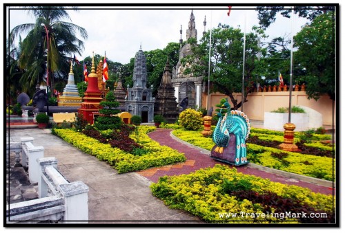 Garden Before the Entrance to Wat Preah Prom Rath with Stupas in the Back My Guide Explain the Purpose of