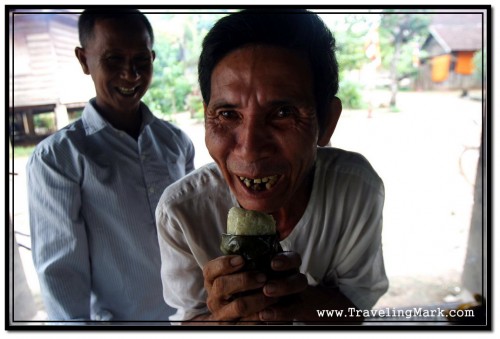 Generous and Welcoming Buddhist Cambodians Offering Me a Sticky Rice Cake Generous and Welcoming Buddhist Cambodians Offering Me a Sticky Rice Cake