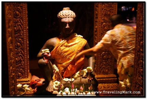 Devoted Buddhist Leaves Offerings for the Statue of Ya-Tep in Siem Reap