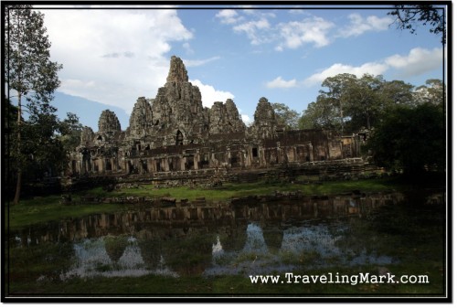 Photo: Bayon Temple in Rainy Season with Reflection in the Water Basin Photo: Bayon Temple in Rainy Season with Reflection in the Water Basin