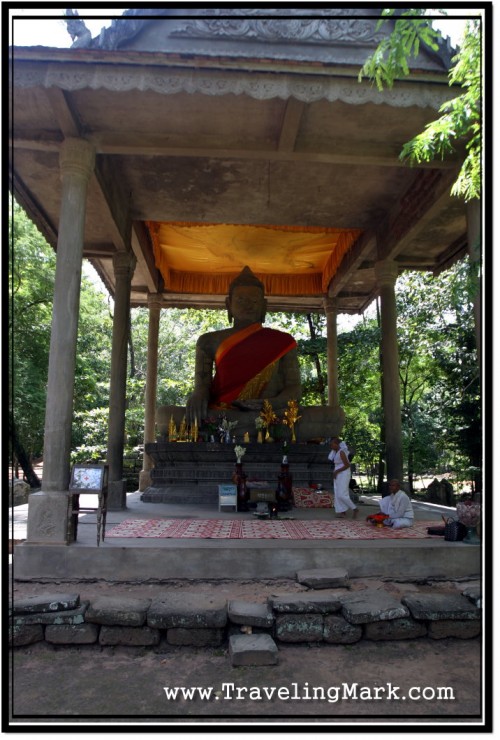 Photo: Sandstone Statue of Buddha at Preah Ngoc Attended to by Two Cambodian Nuns