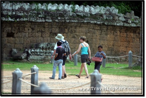 Photo: Touts Pestering Tourists at One of Angkor Archaeological Park Temples