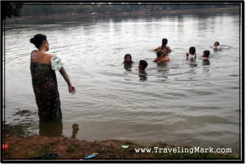 Photo: Villagers Bathing in Sras Srang at Dusk