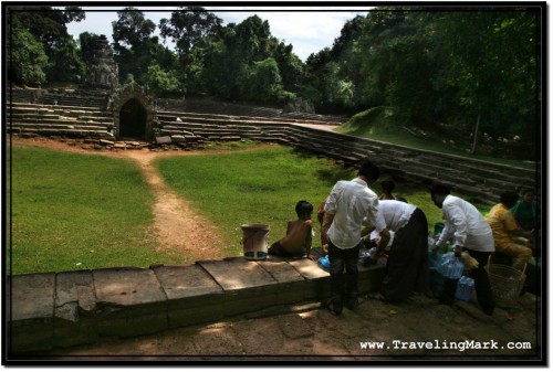 Photo: Cambodian Family Having a Picnic at the Dry Connected Pool of Neak Pean Photo: Cambodian Family Having a Picnic at the Dry Connected Pool of Neak Pean