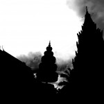 Silhouettes of Wat Preah Prom Rath Against Cloudy Skies
