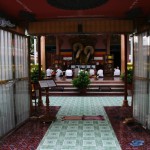 Praying Buddhists I Have Seen Through Main Gate to the Temple