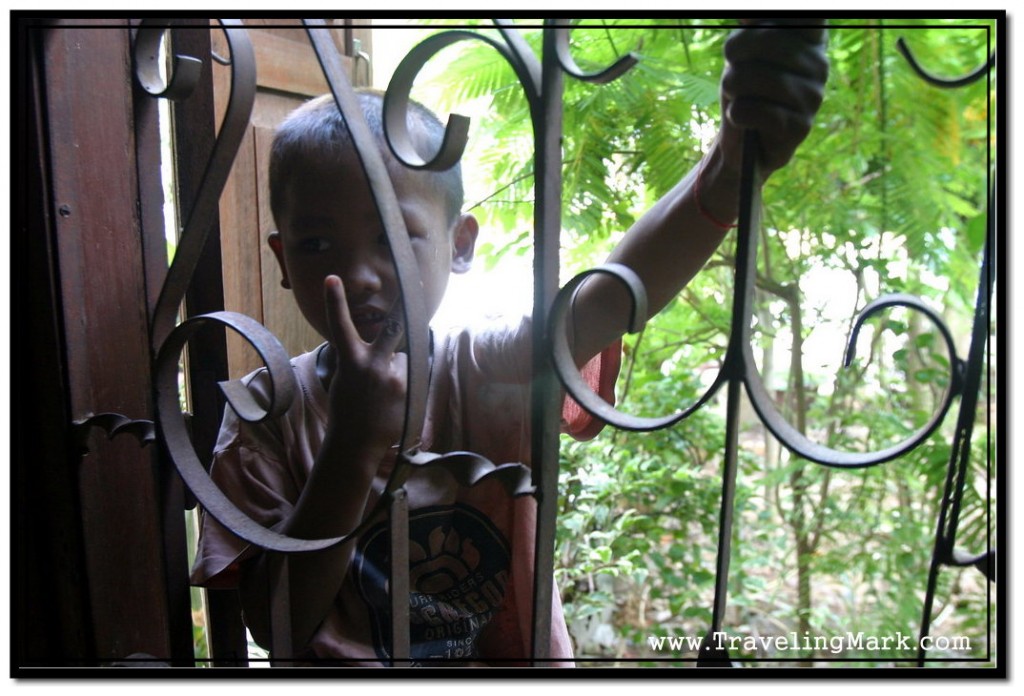 Photo: Cambodian Child Came to Check Out What Was Going on Inside of Wat Keseram's Prayer Hall