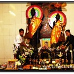 Young Khmer Couple Leaves Gifts at Buddha Statues