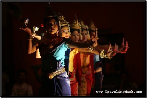 Photo: Dimly Lit Stage with Lights Shining at Apsara Dancers from the Bottom