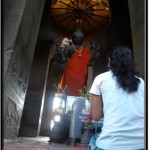 Photo: Cambodian Woman Prays Before the Depiction of Vishna, Remnant of Hinduism