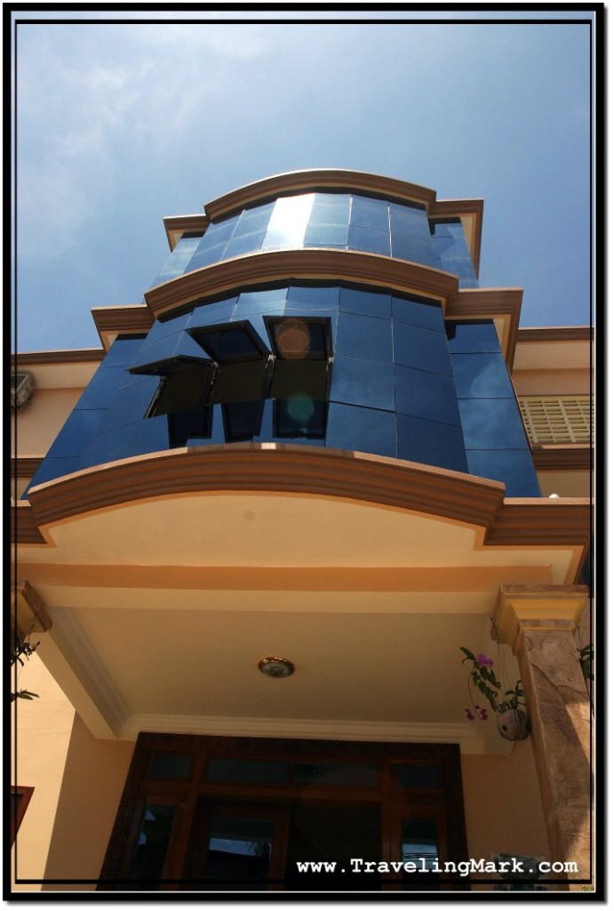 Photo: Blue Tinged Windows Above Entrance to Prohm Roth Guesthouse in Siem Reap