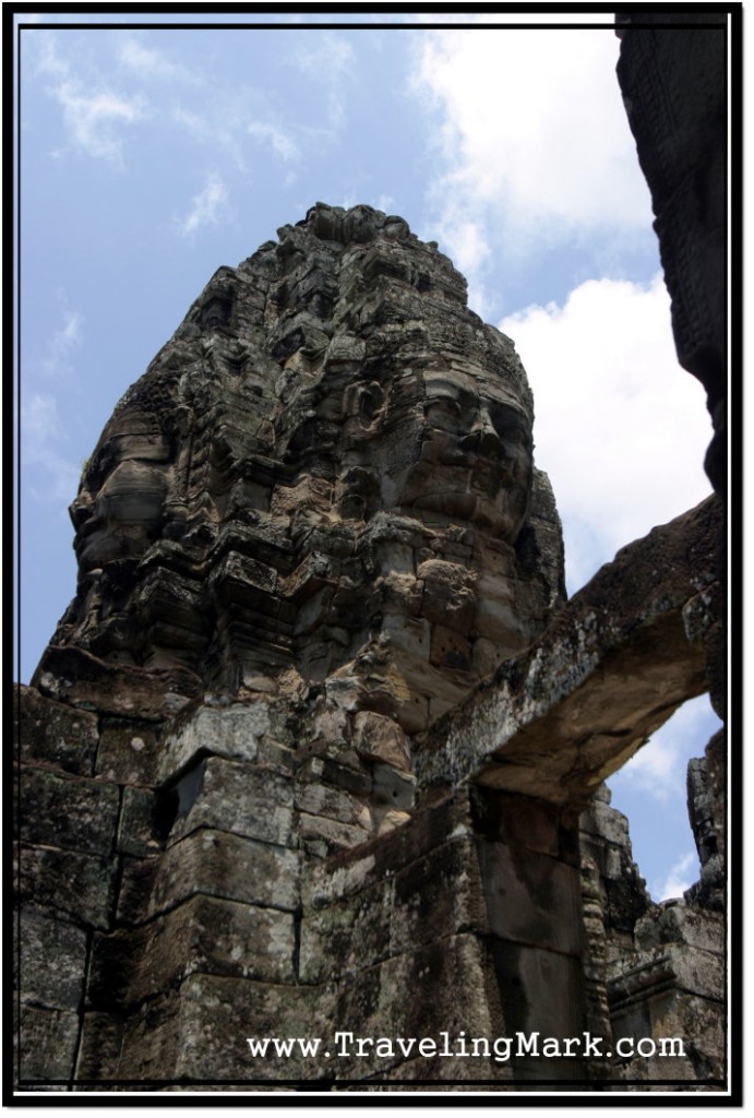 Photo: Stone Frame and a Tower of Four Giant Faces Looking to Cardinal Point