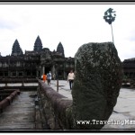 Photo: Damaged Naga at the End of Balustrade Lining Up the Causeway to Angkor Wat