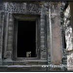 Photo: Doorway Leading to a Corridor with Gallery Housing Buddha Statue