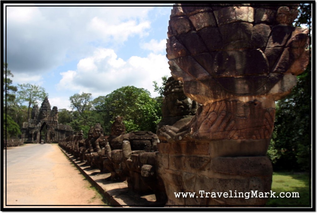 Photo: Head of Naga Whose Body is Held by Asuras in a Tug of War Pose Alongside Causeway Leading to Angkor Thom South Gate