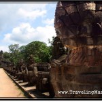 Photo: Head of Naga Whose Body is Held by Asuras in a Tug of War Pose Alongside Causeway Leading to Angkor Thom South Gate