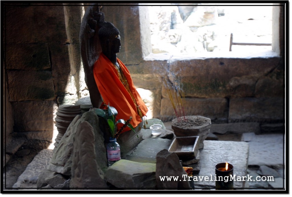 Photo: Insence Stick Burning Before the Image of Buddha at Bayon Temple