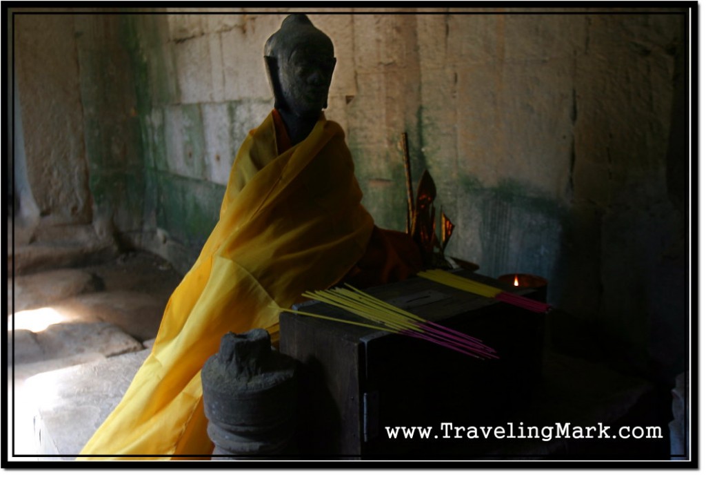 Photo: Small Statue of Buddha Draped in Saffron Robe Located at Ta Prohm Temple, Angkor