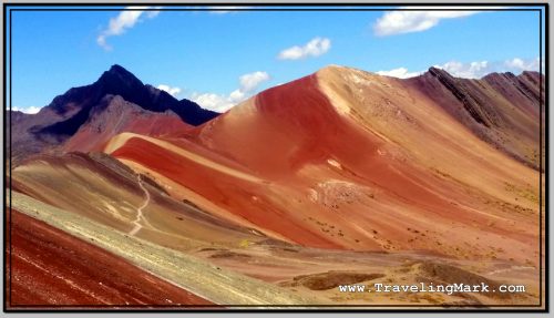 Photo: Rugged Red Valley with Slope of Rainbow Mountain in Bottom Left