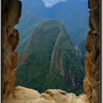 Photo: View of Mountains Surrounding Machu Picchu Through Window of Guard House