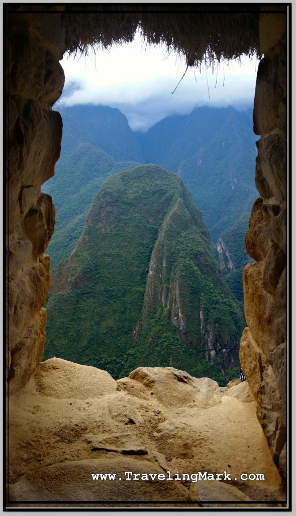 Photo: View of Mountains Surrounding Machu Picchu Through Window of Guard House